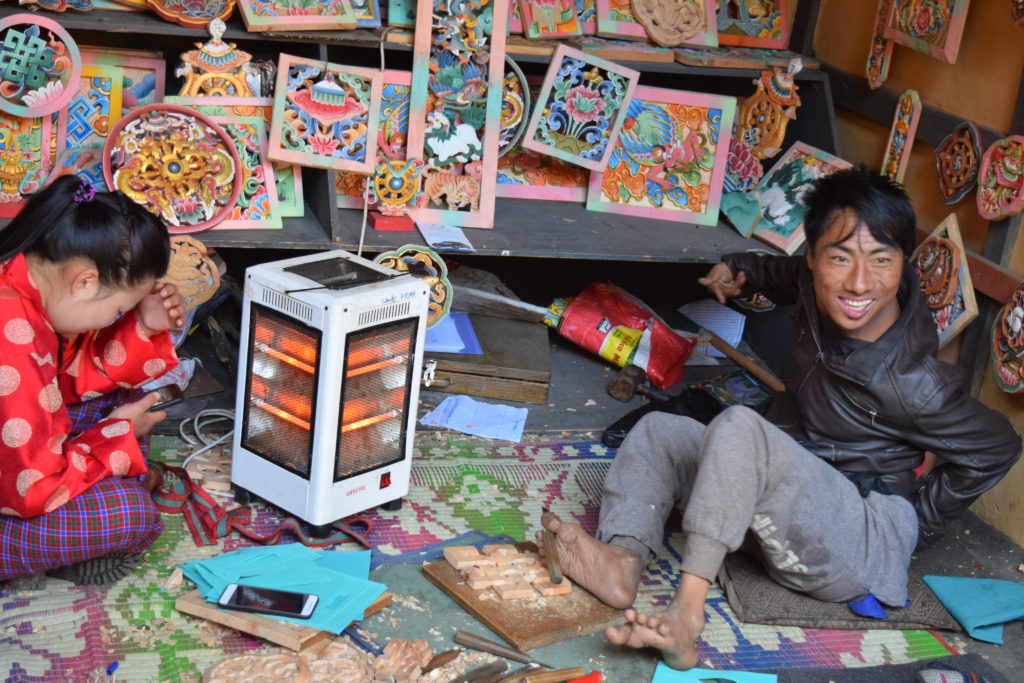 Pema and his art work at Simply Bhutan